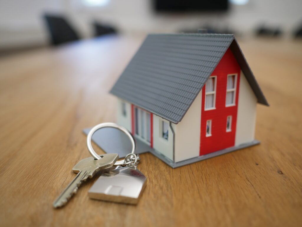 small prototype house with a key ring with house key