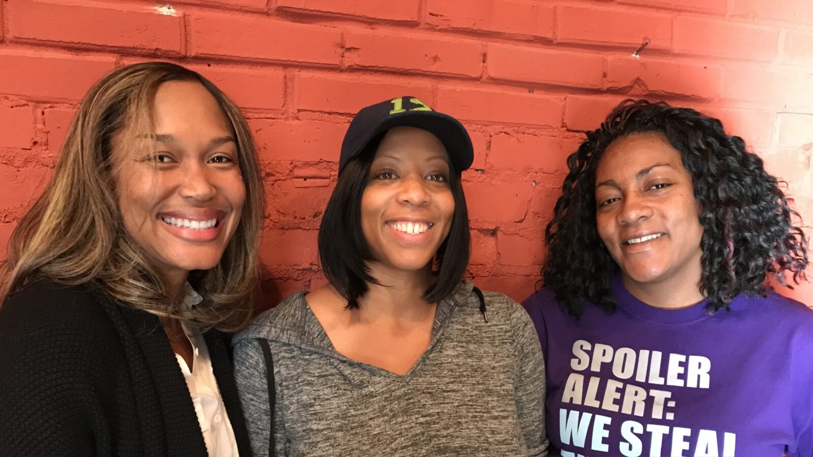 Former CEO Andrea Caupain Sanderson stands with Angelique Kitchen and Robin Byrd after talking about changing the organization's name to honor Ms. Roberta Byrd Barr, their grandmother.