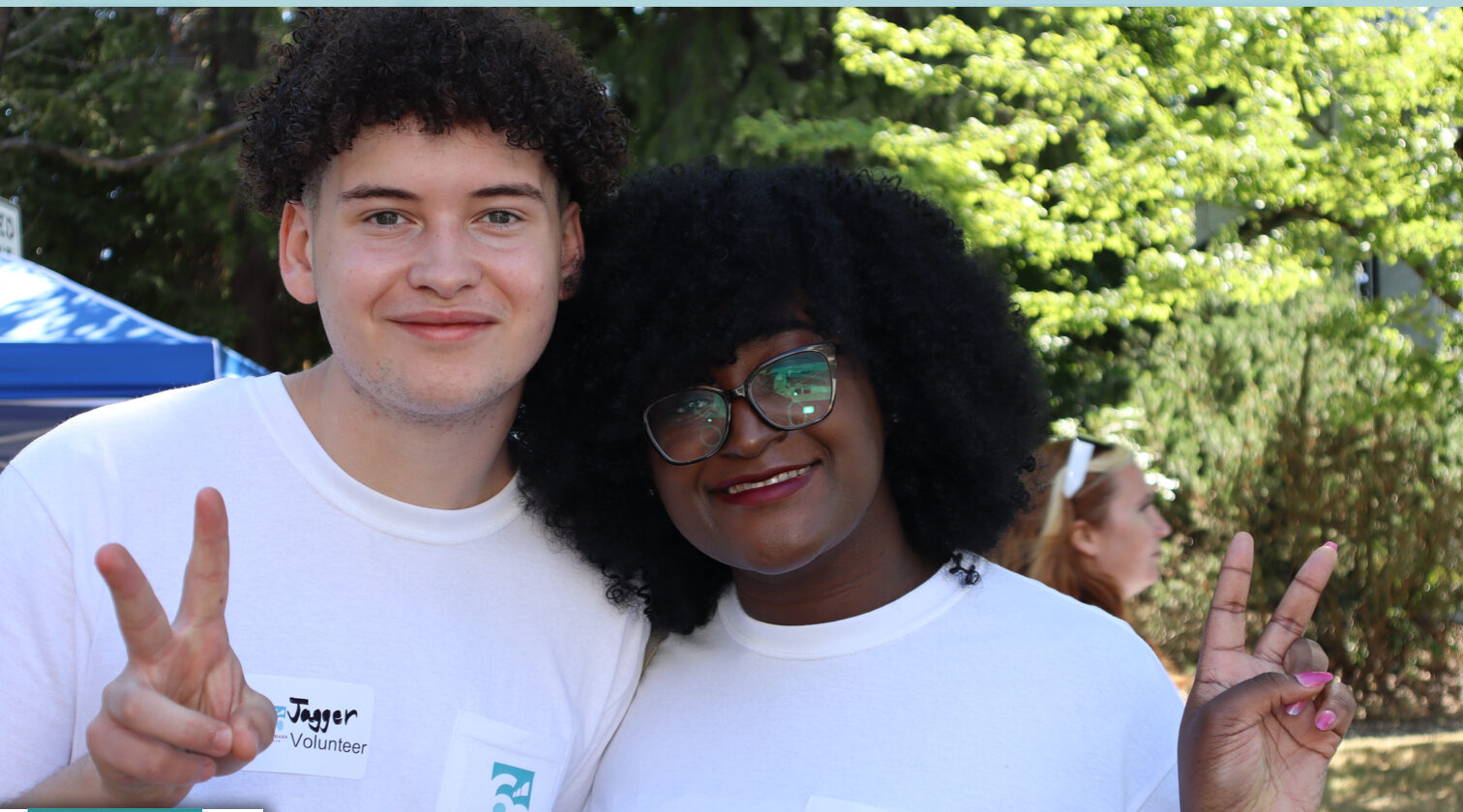 Two members of the Byrd Barr Place team smile at the camera.